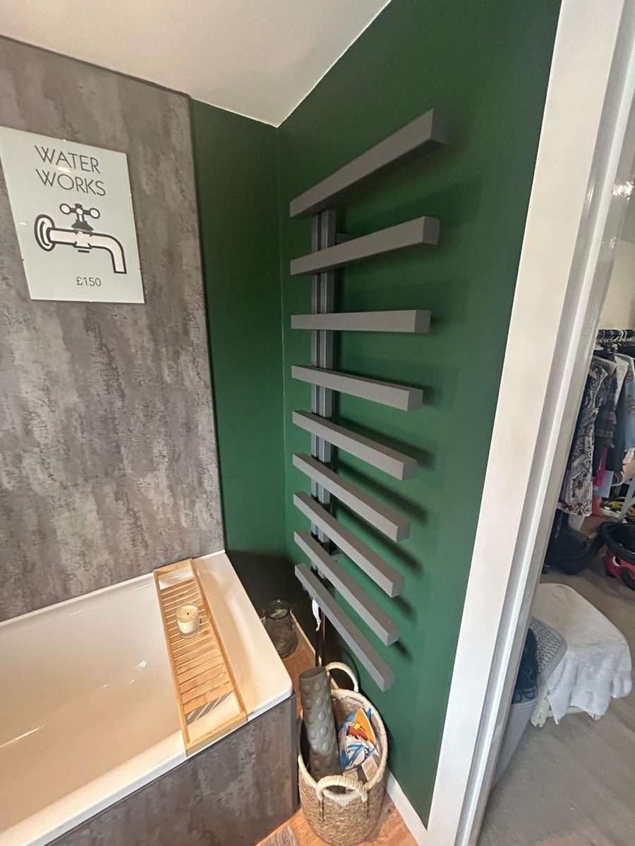 Heated towel rail installation completed by DM Heating and Cooling, Gas Safe registered engineers in Kent